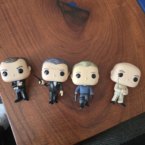 Funko Pop Figures with Black, Gray, and Cream Outfits From James Bond Movies - Picture 2 of 6